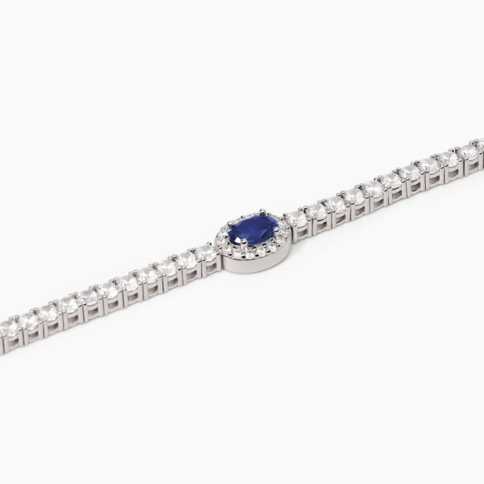 Pulsera de tenis para mujer en plata con zafiro sintético ovalado.