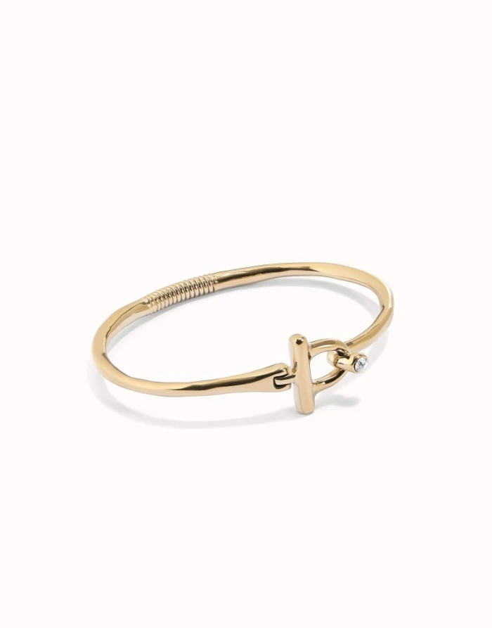 Pulsera con cierre frontal bañada en oro 18k con topacio blanco