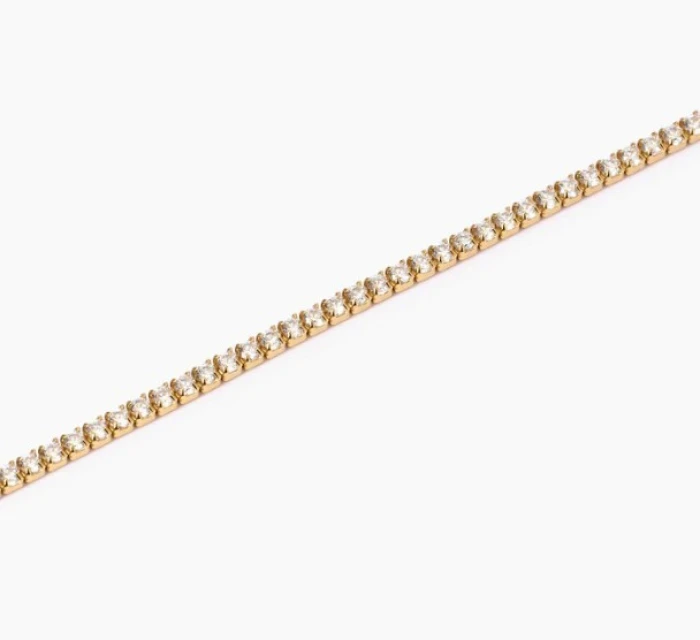 Pulsera fina de tenis en plata chapada en oro con circonitas.