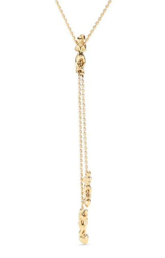 Cadena bañada en oro 18k con tres figuras, una ajustable en el centro.
