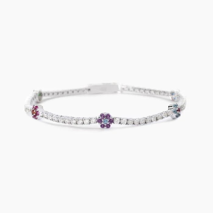 Pulsera de tenis con elementos florales.FLOR FLOR